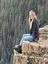 Runner sitting by a cliff